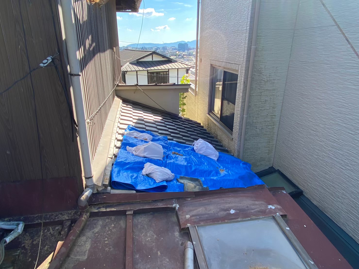 Temporary roof tarp after storm