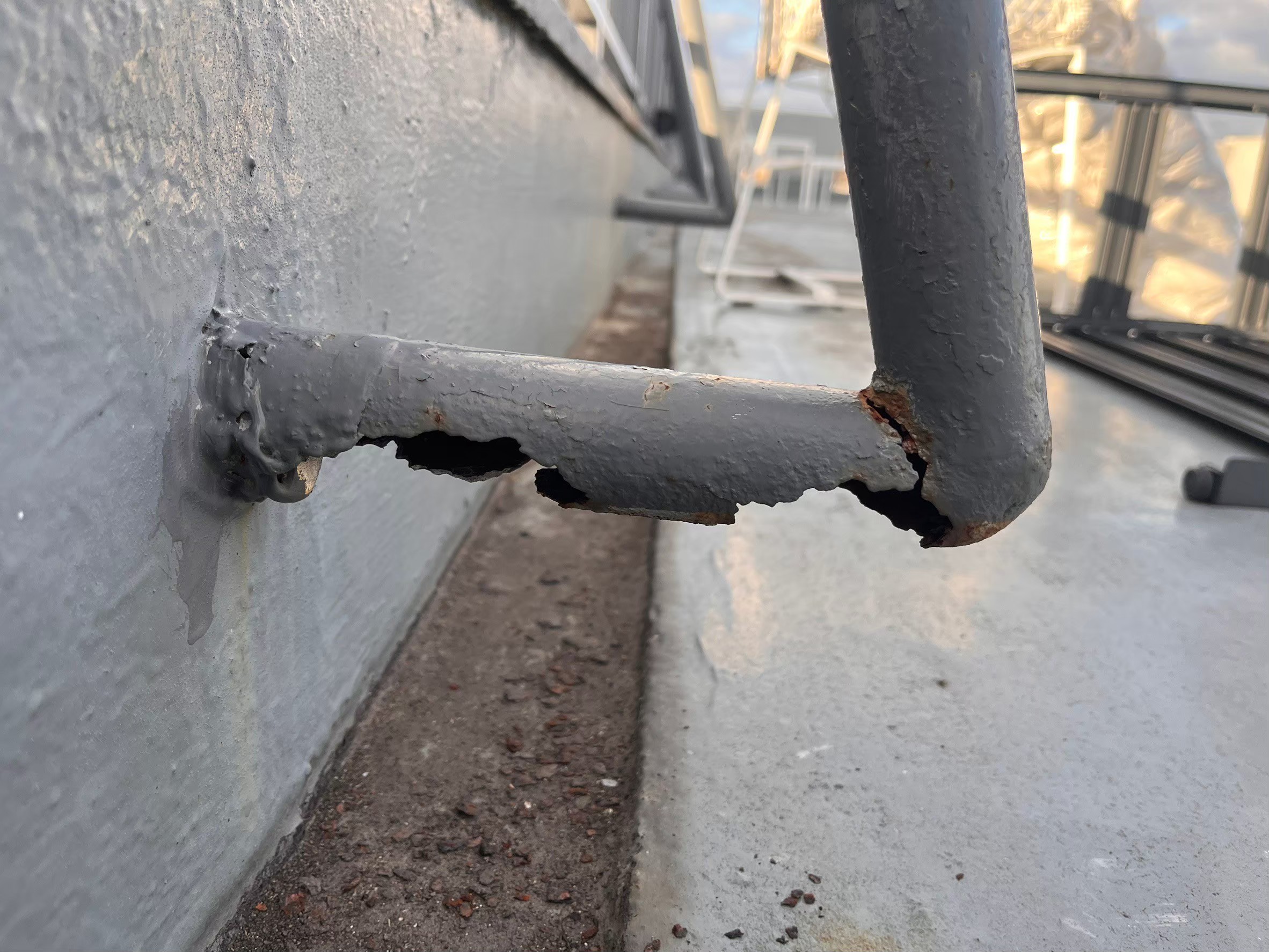 Damaged rooftop railing