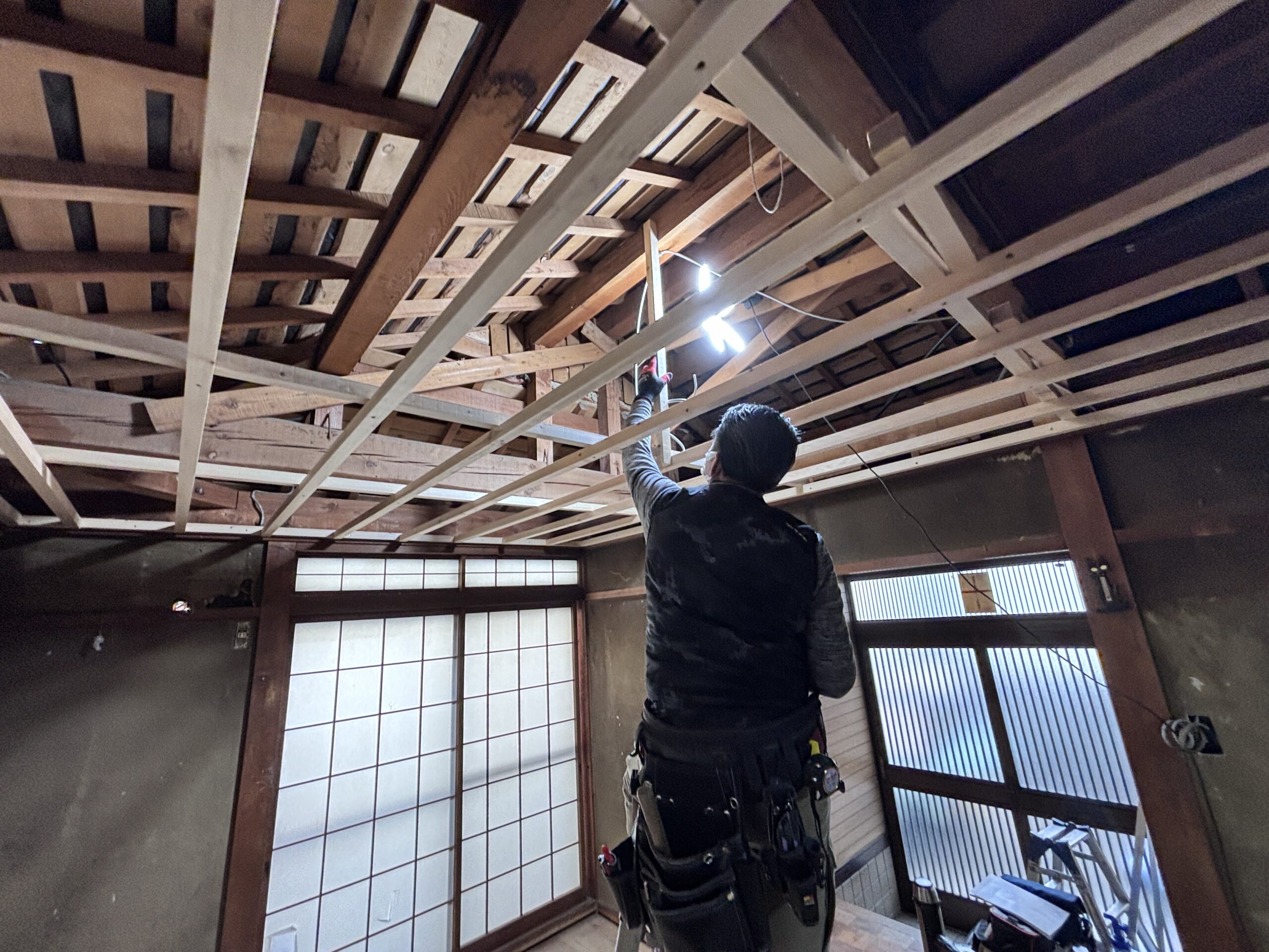 Ceiling carpentry work in progress during house renovation in Kyoto