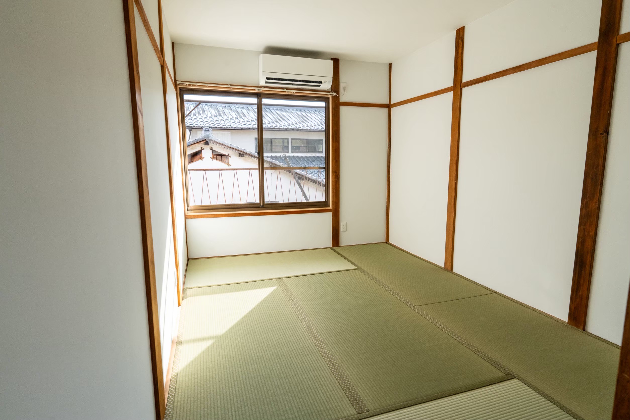 After renovation of a tatami room with new tatami mats and white walls in Kyoto