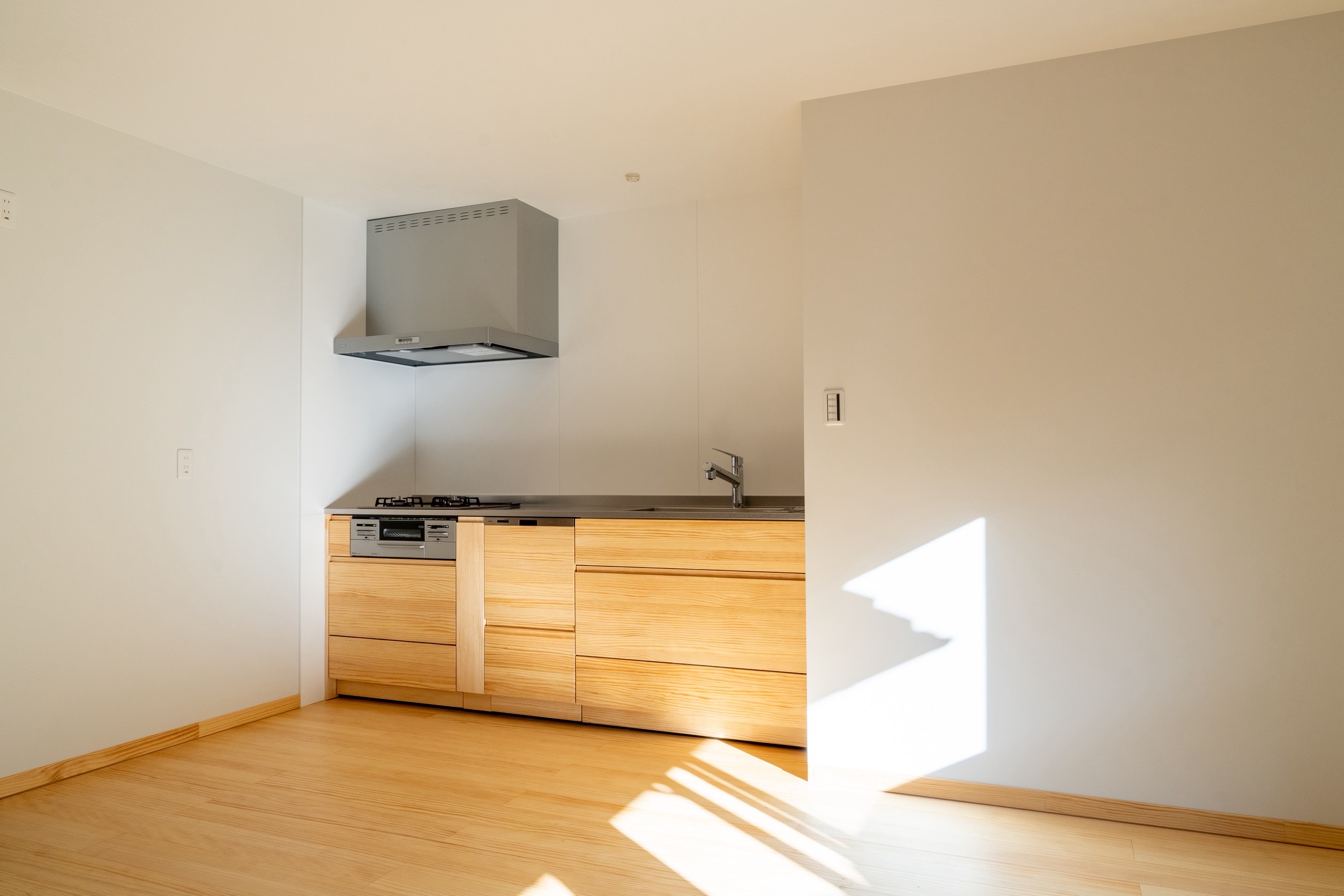 After renovation of a tatami room into a dining space with solid wood flooring and kitchen in Kyoto